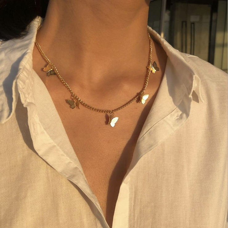 Butterfly necklace shown on model