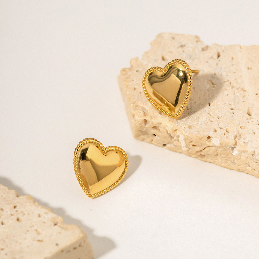 Heart stud earrings side view