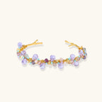 Fluorite and freshwater pearl gold-tone cuff bracelet on white background