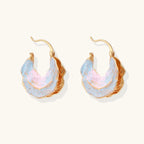 Iridescent shell hoop earrings close-up detail