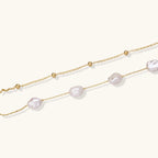 Gold-tone double-strand pearl bracelet close-up