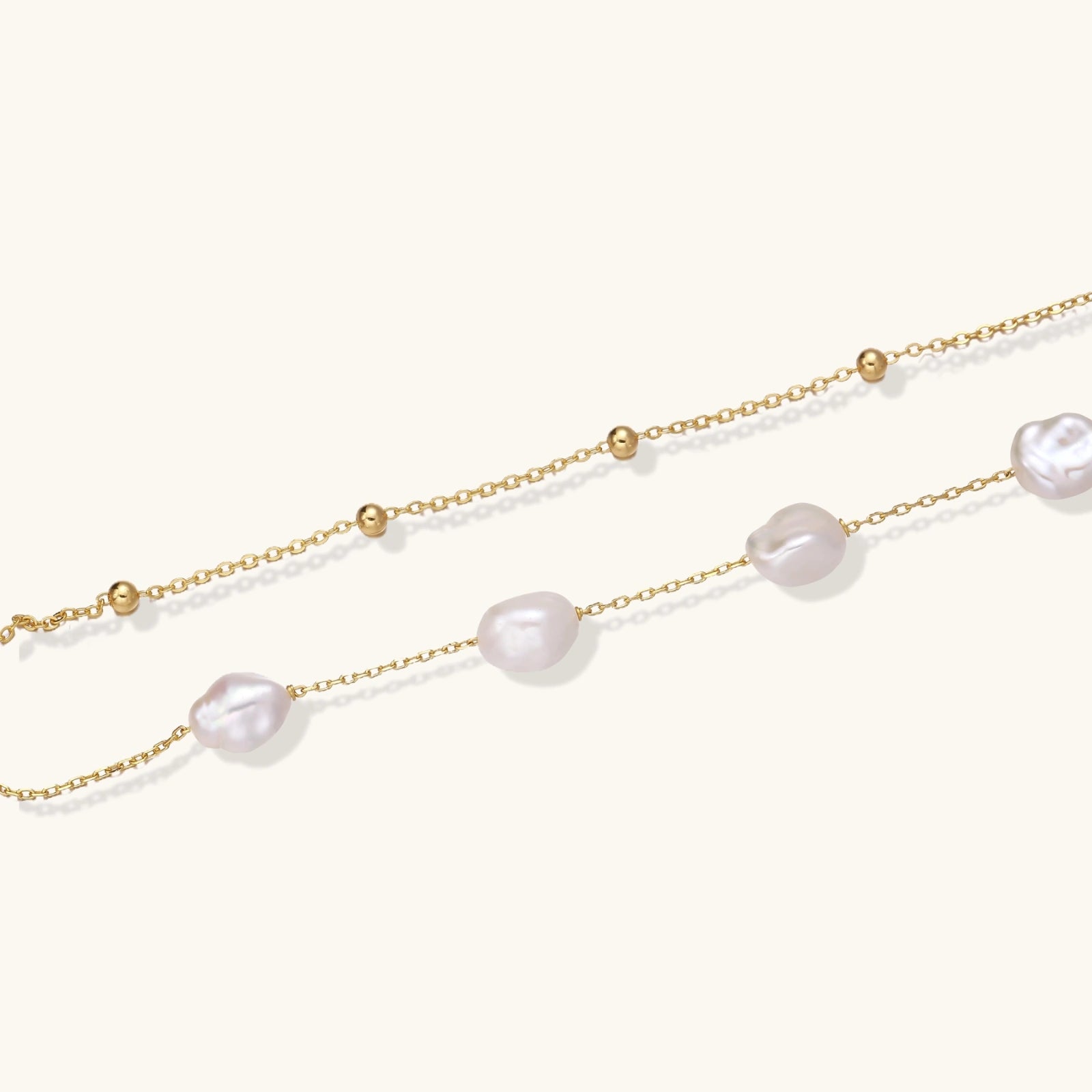 Gold-tone double-strand pearl bracelet close-up