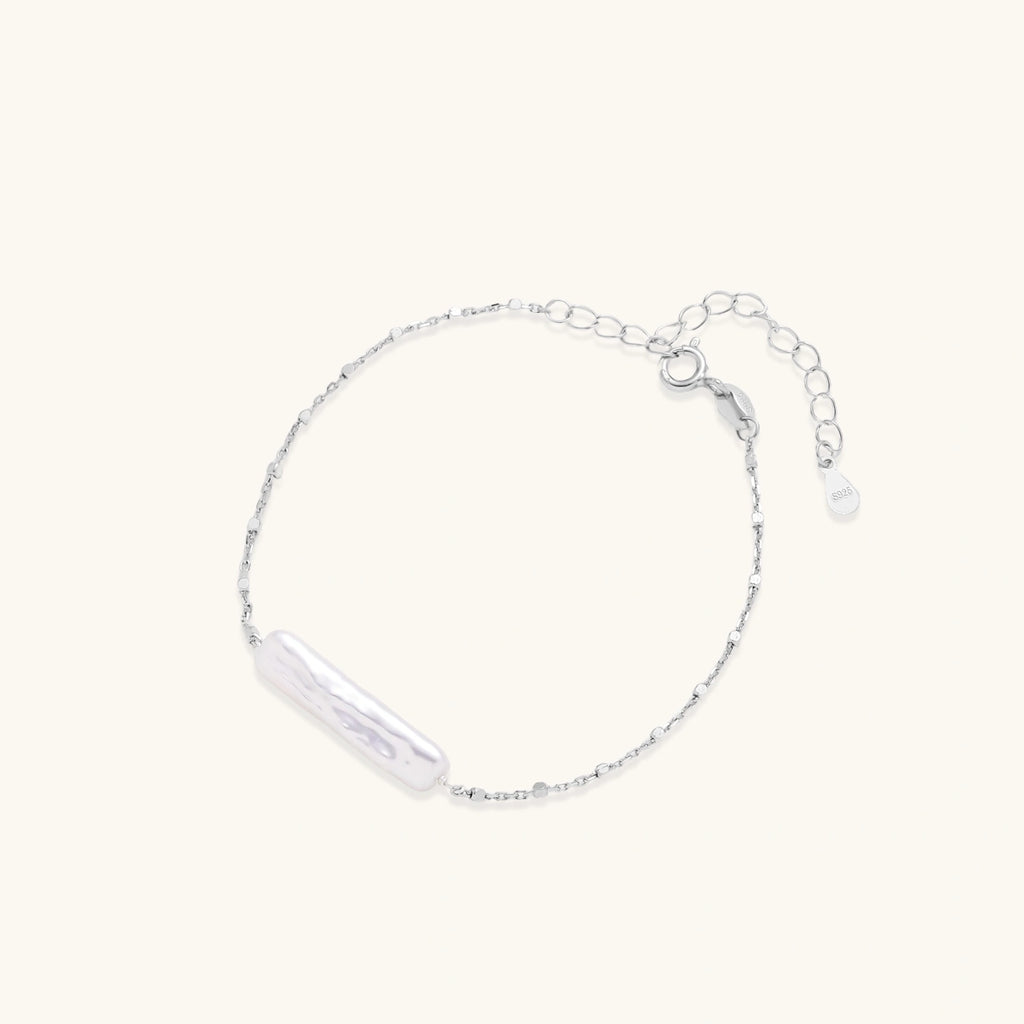 Baroque pearl chain bracelet in silver-tone on cream background
