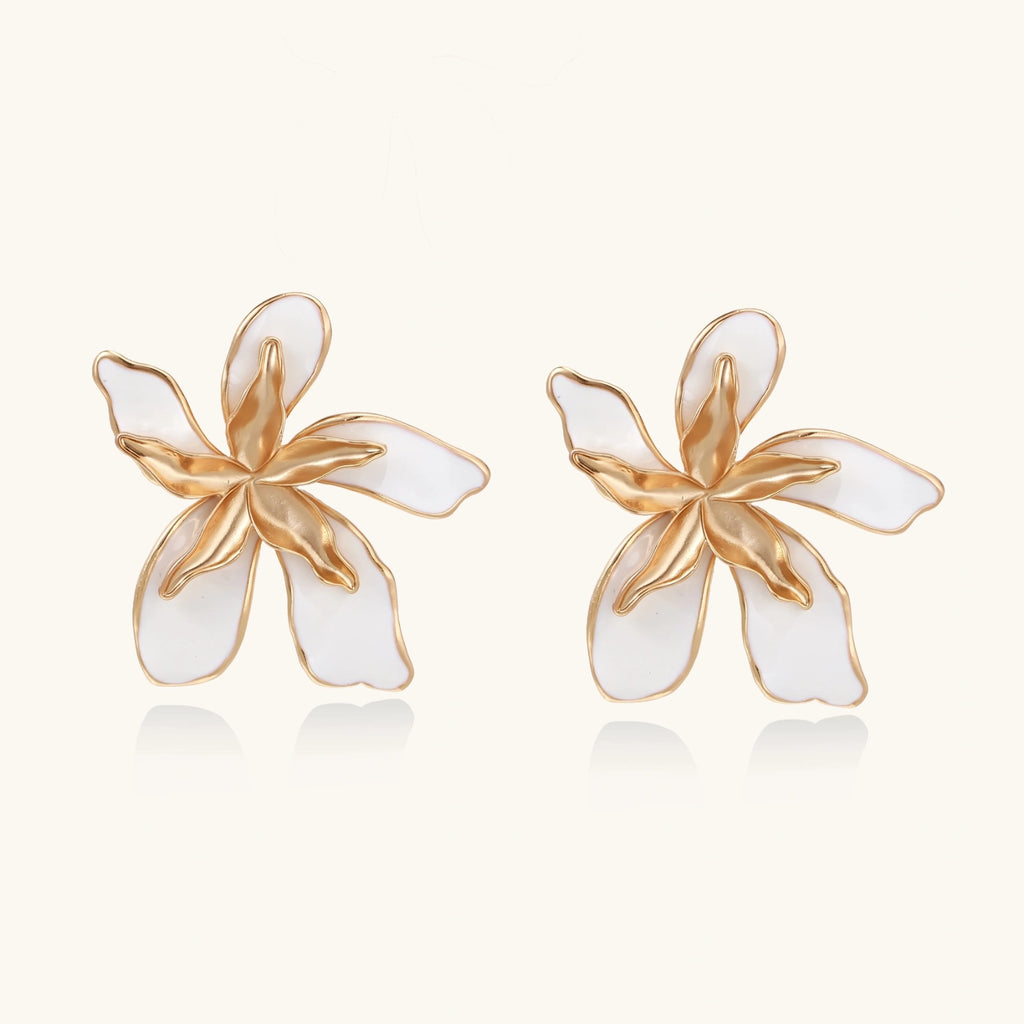 White enamel petal earrings close-up