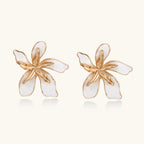 White enamel petal earrings close-up