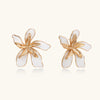 White enamel statement flower earrings in gold-tone