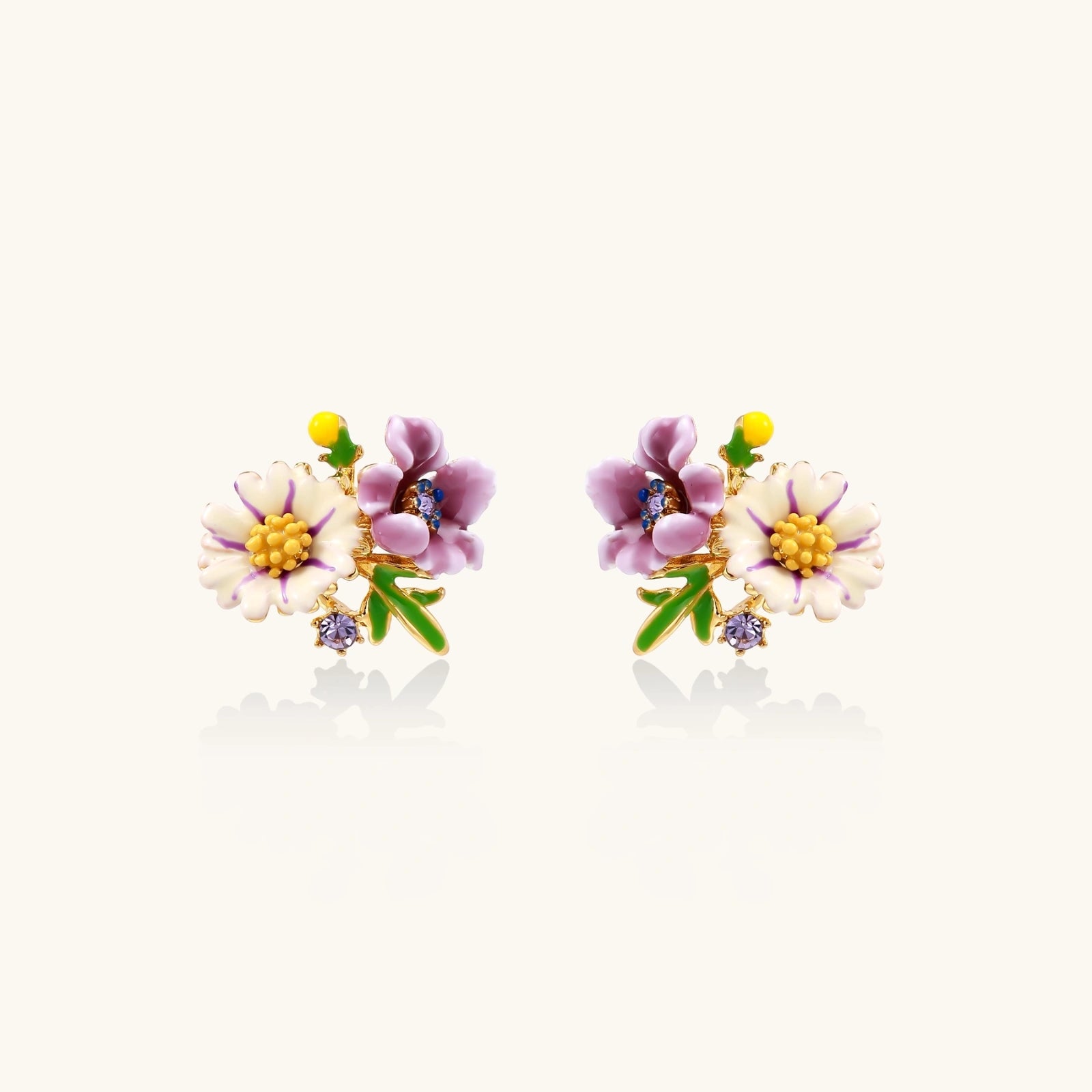Enamel daisy and pansy studs close-up