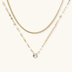 Gold-tone dual-chain layered necklace with crystal accent