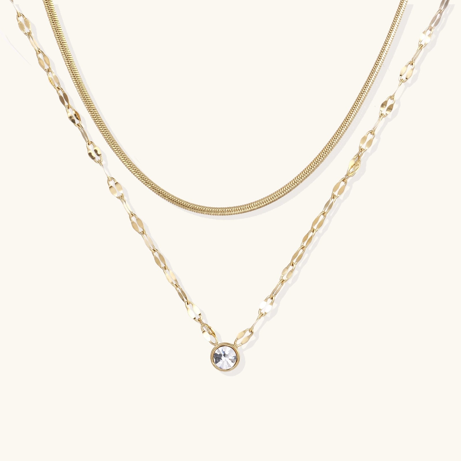 Gold-tone dual-chain layered necklace with crystal accent
