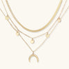 Four-layer gold-tone necklace set with crescent moon charm