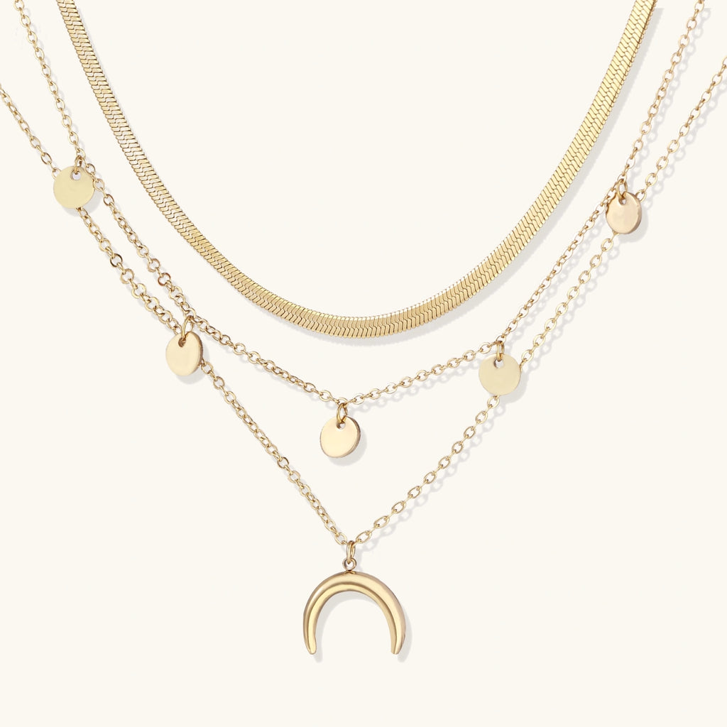 Four-layer gold-tone necklace set with crescent moon charm