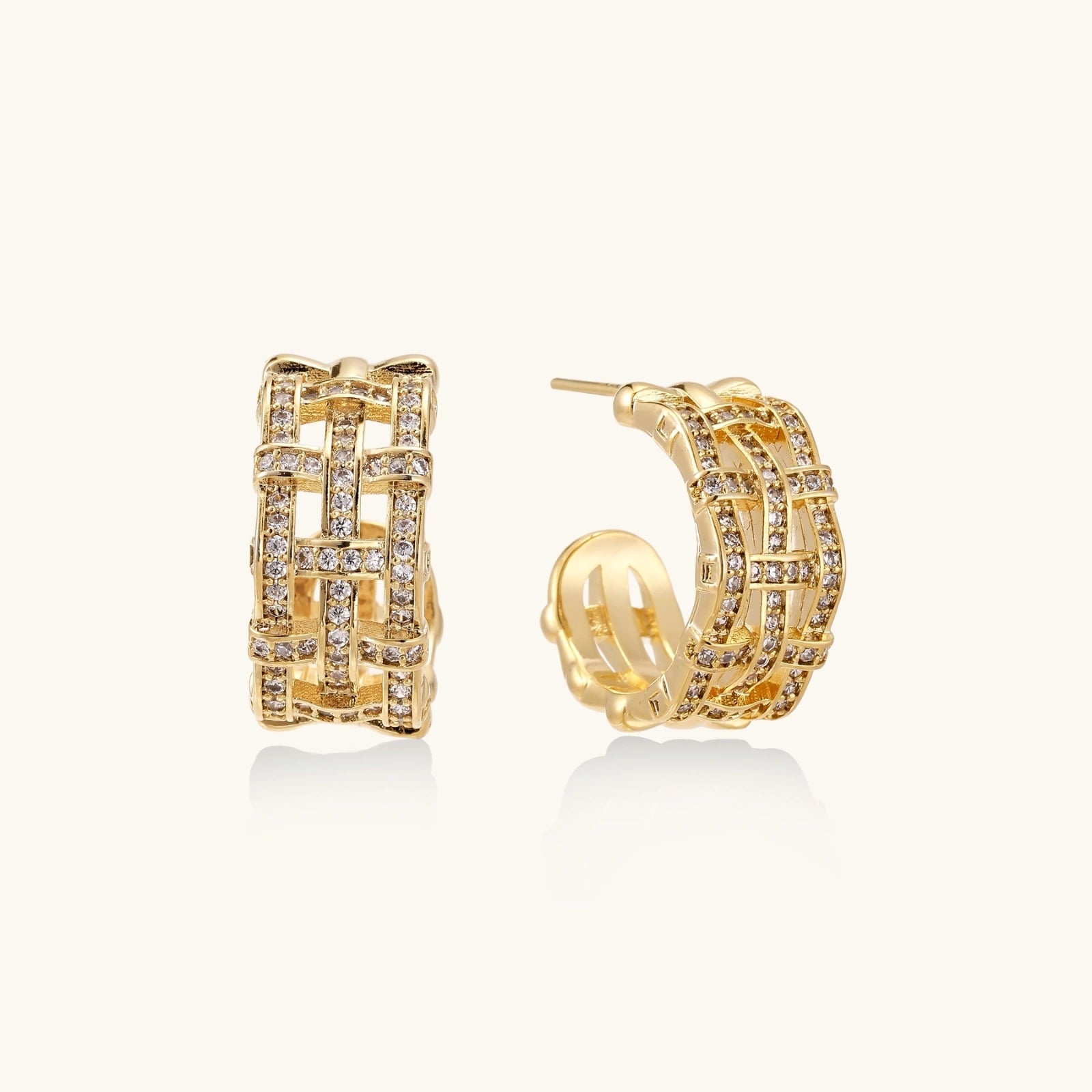 Lattice openwork gold hoops on cream background