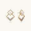 Pearl geometry earrings in gold-tone on white background