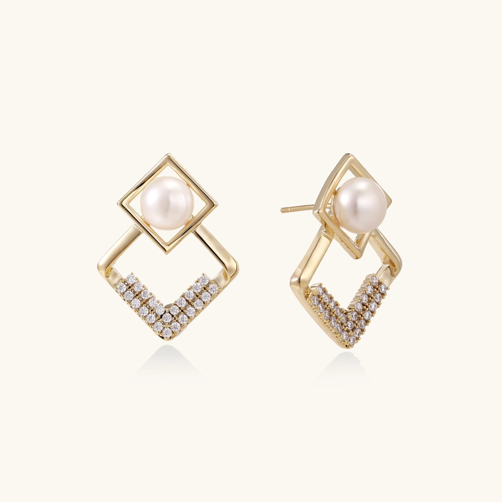 Pearl geometry earrings in gold-tone on white background