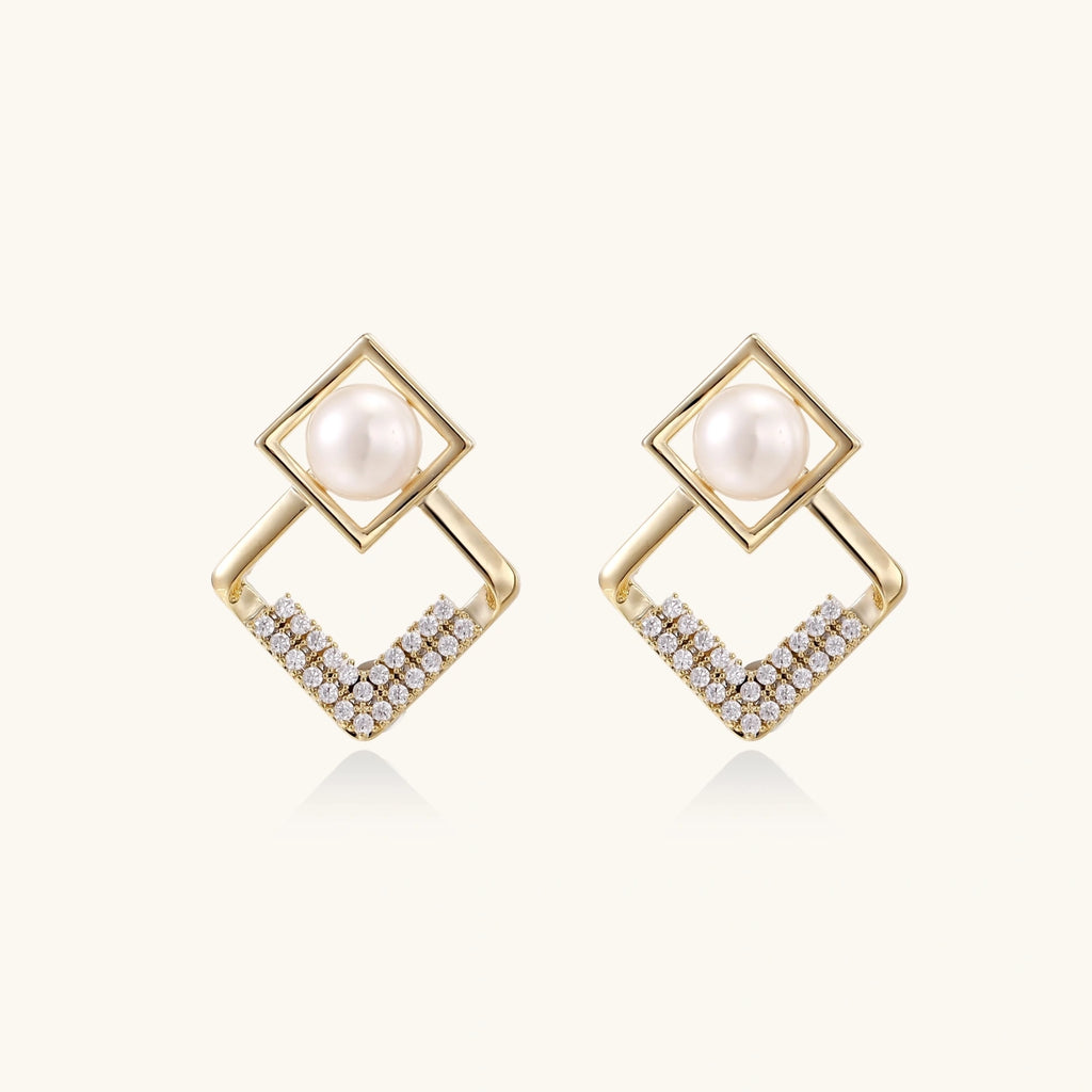 Gold-tone double-frame pearl earrings close-up