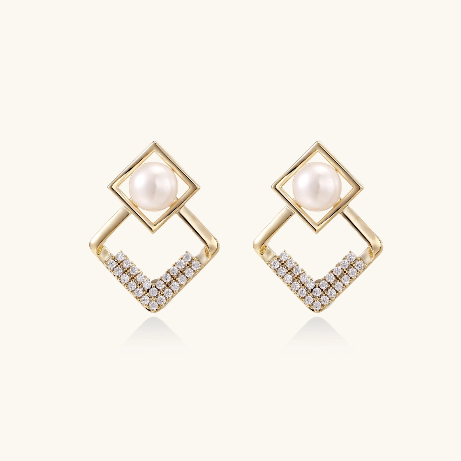 Gold-tone double-frame pearl earrings close-up