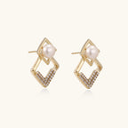 Pearl geometry earrings shown as a pair