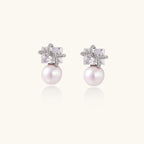 Silver-tone crystal and pearl drop earrings close-up