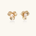 Bloom pearl flower studs in gold-tone on beige background