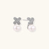 Crystal bloom pearl studs in silver-tone on cream background