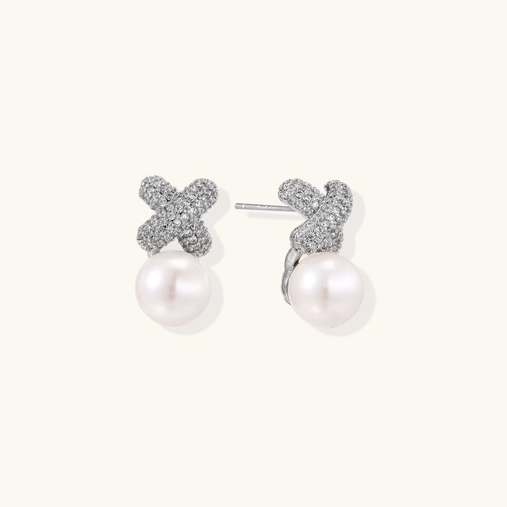 Crystal bloom pearl studs in silver-tone on cream background