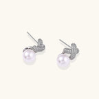 Pavé crystal and pearl stud earrings detail