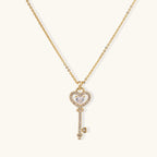 Secret heart key necklace in gold-tone on cream background