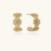 Bloom filigree gold hoops on cream background