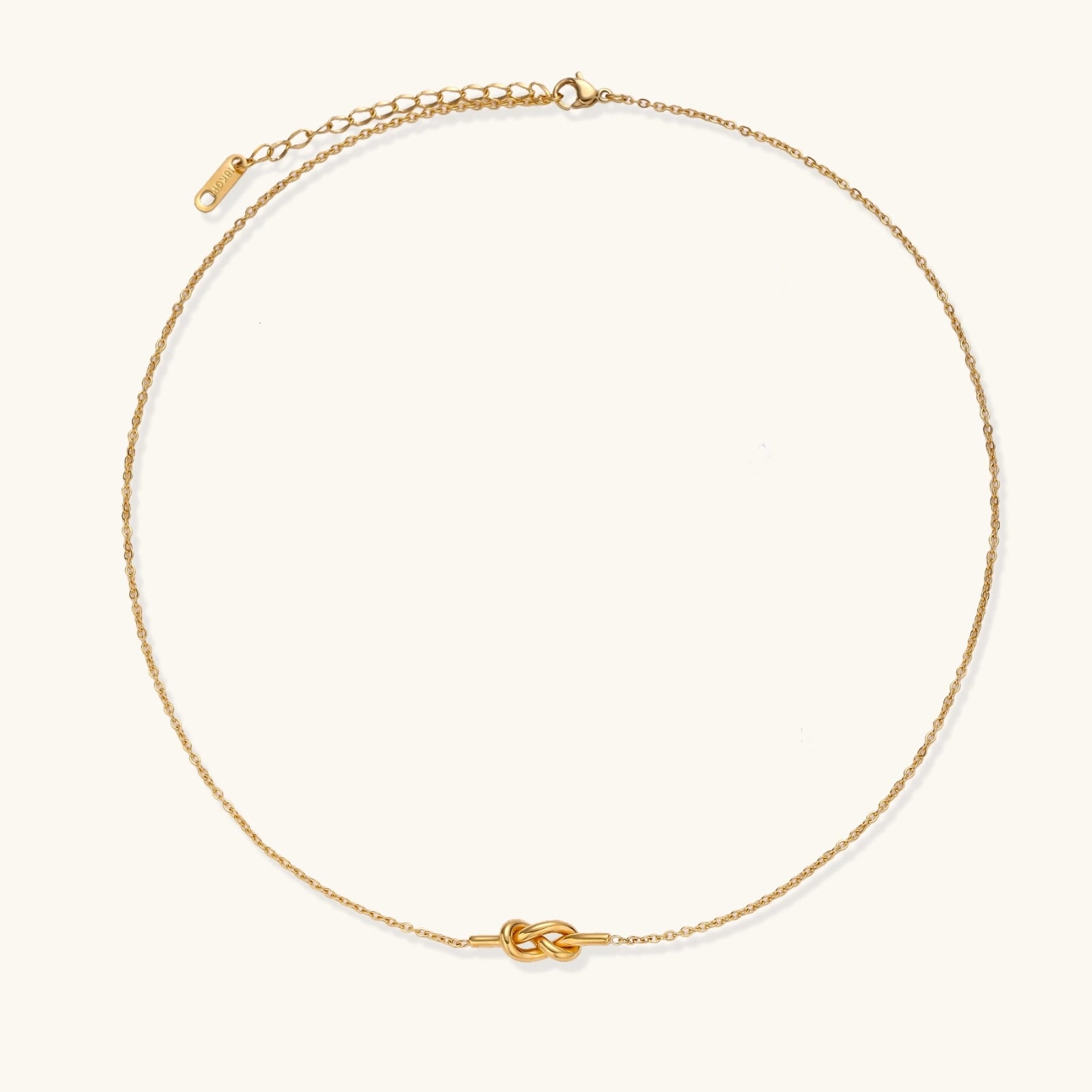 18K gold-plated knot necklace on white background