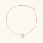 Gold-tone butterfly necklace shown on model