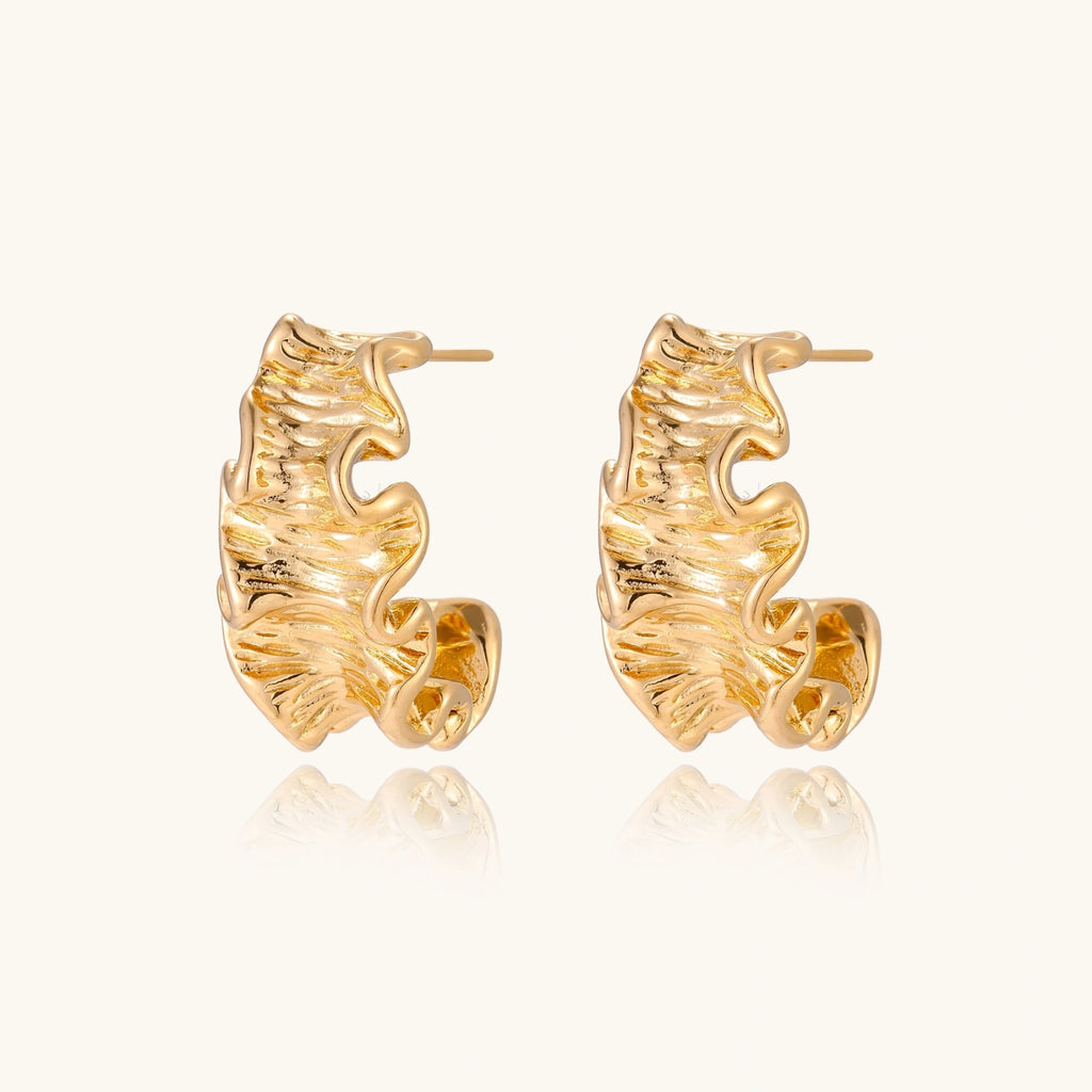 Gold-tone wave hoop earrings detail