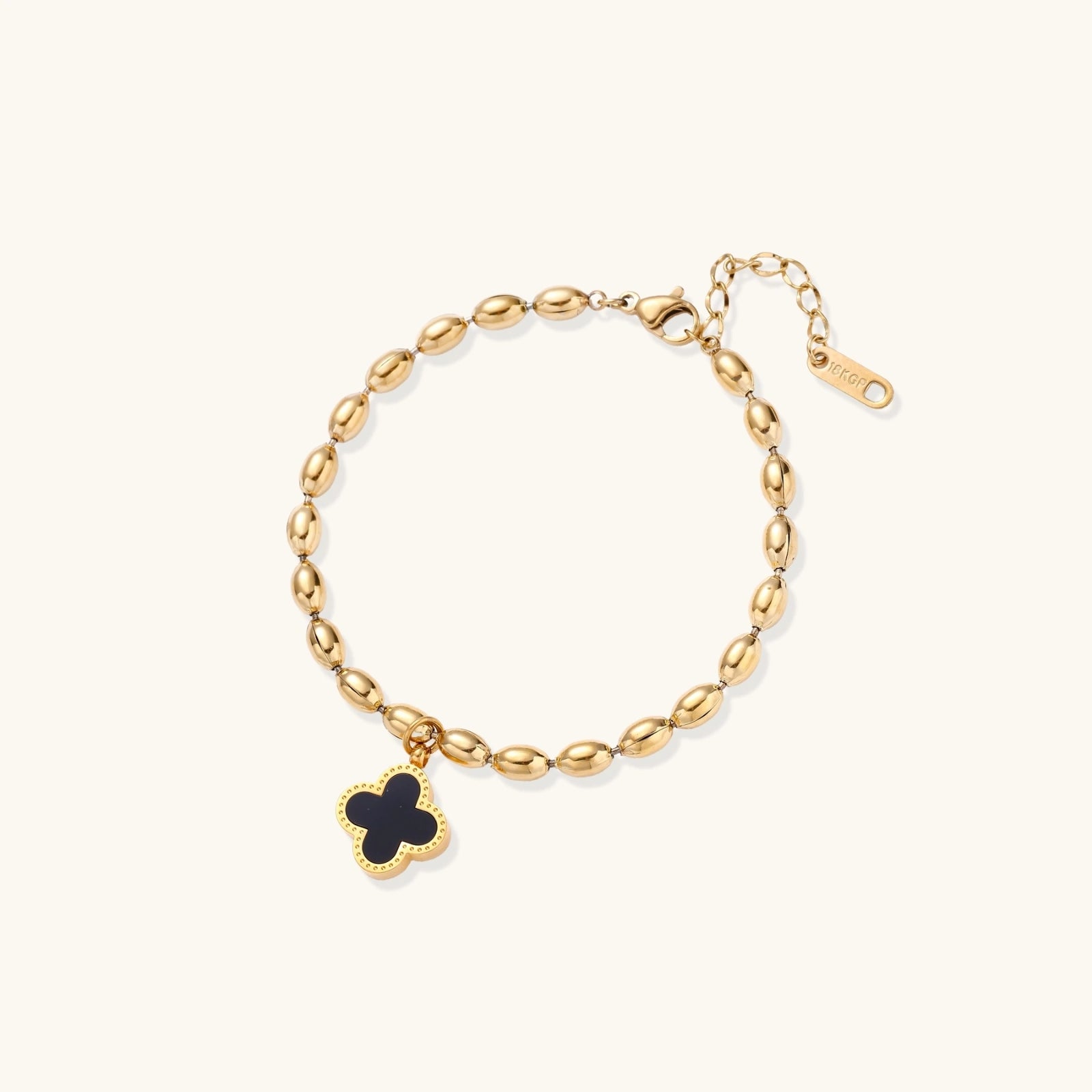 Beaded gold-tone clover bracelet shown on wrist