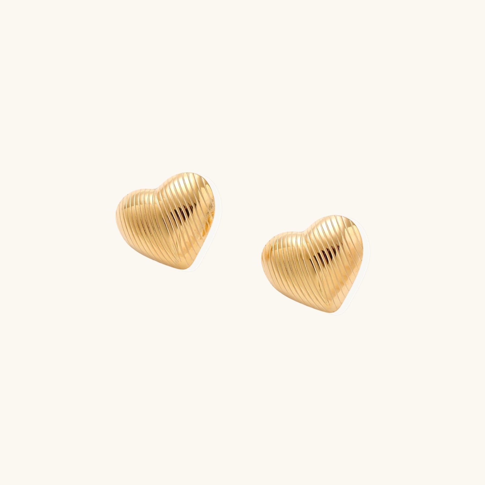 Gold-tone heart stud earrings shown as a pair