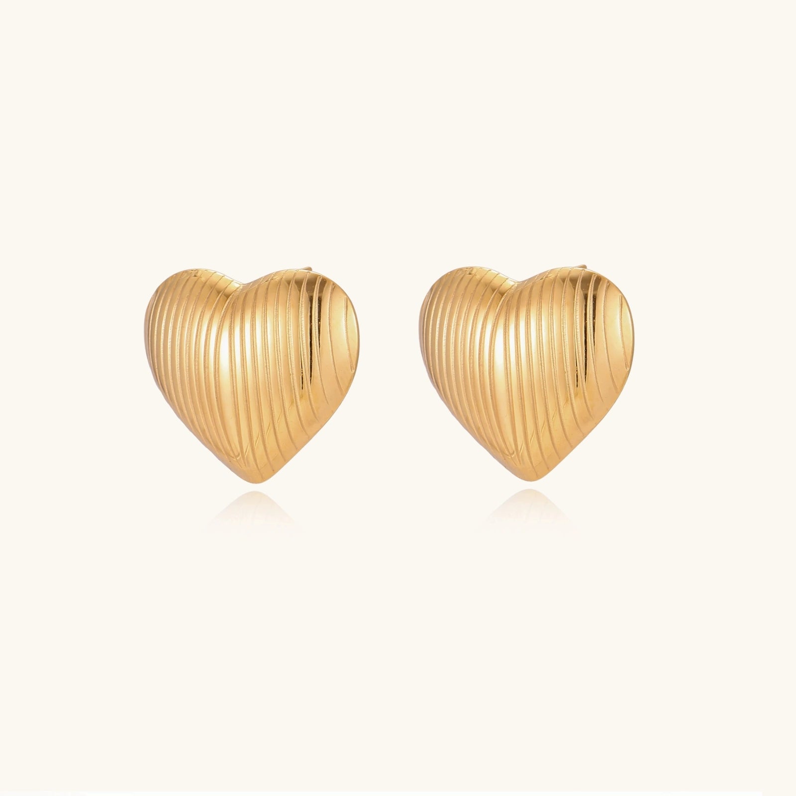 Heart stud earrings side view