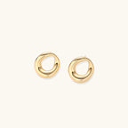 Sculptural gold-tone teardrop earrings detail