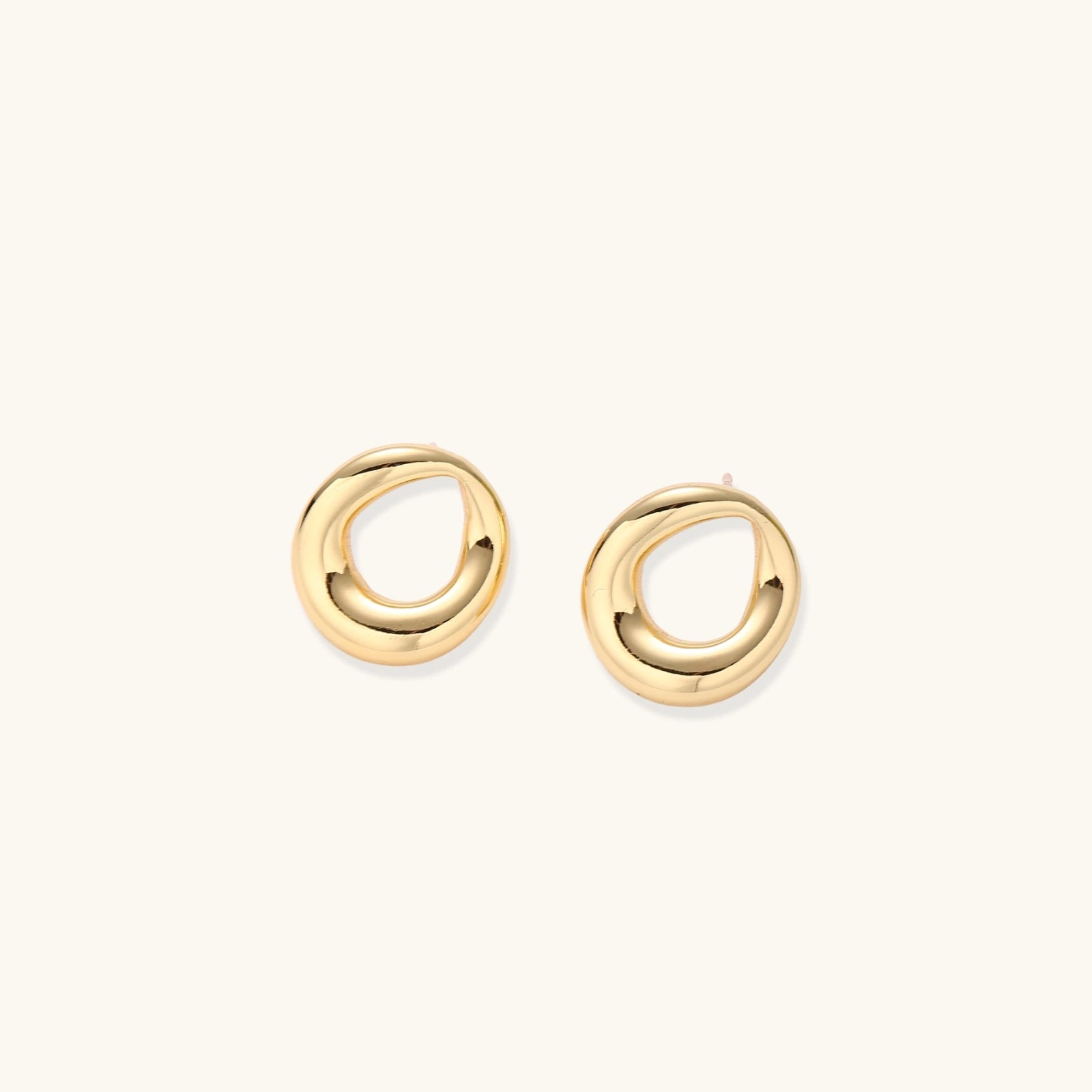 Sculptural gold-tone teardrop earrings detail