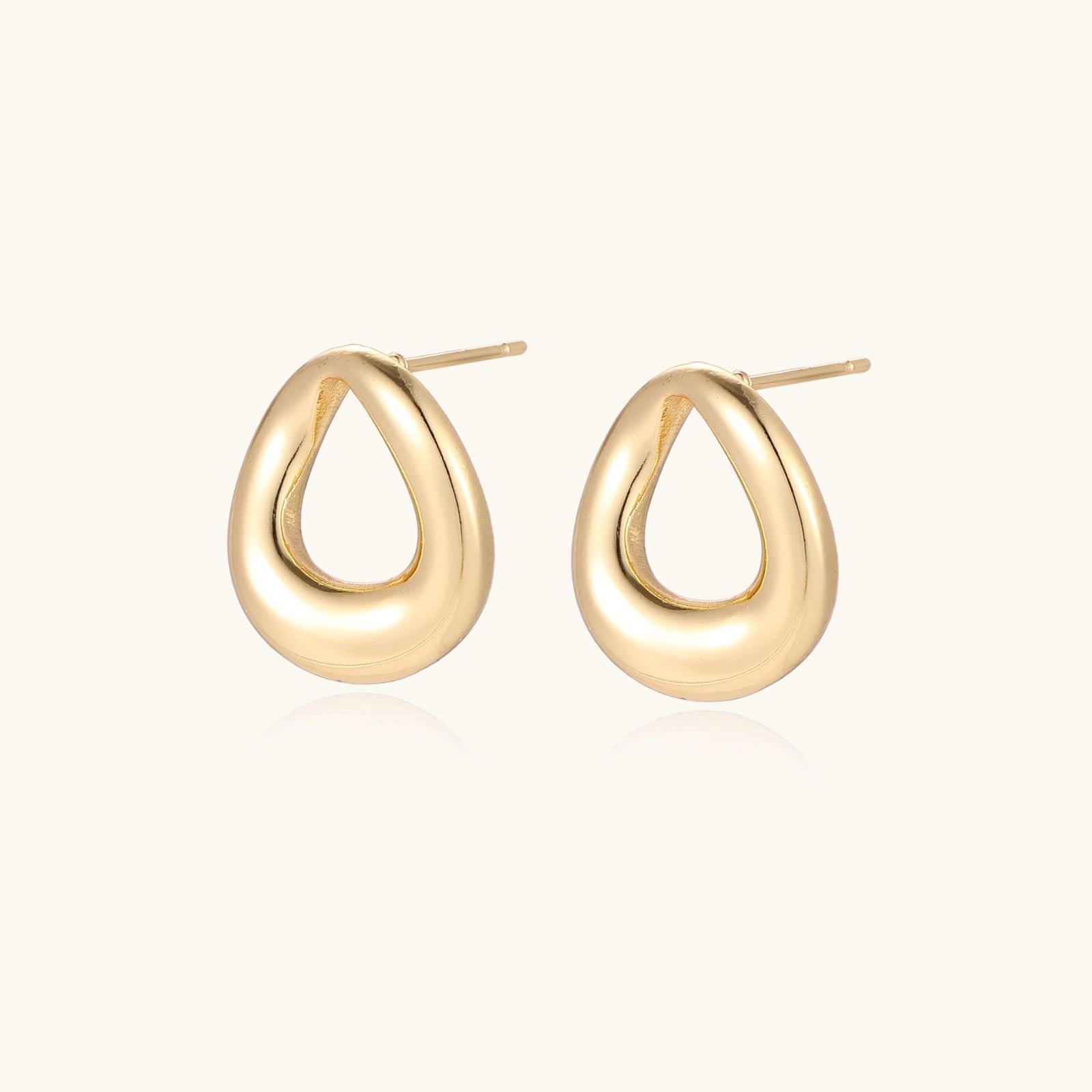 Gold-tone teardrop studs shown as a pair
