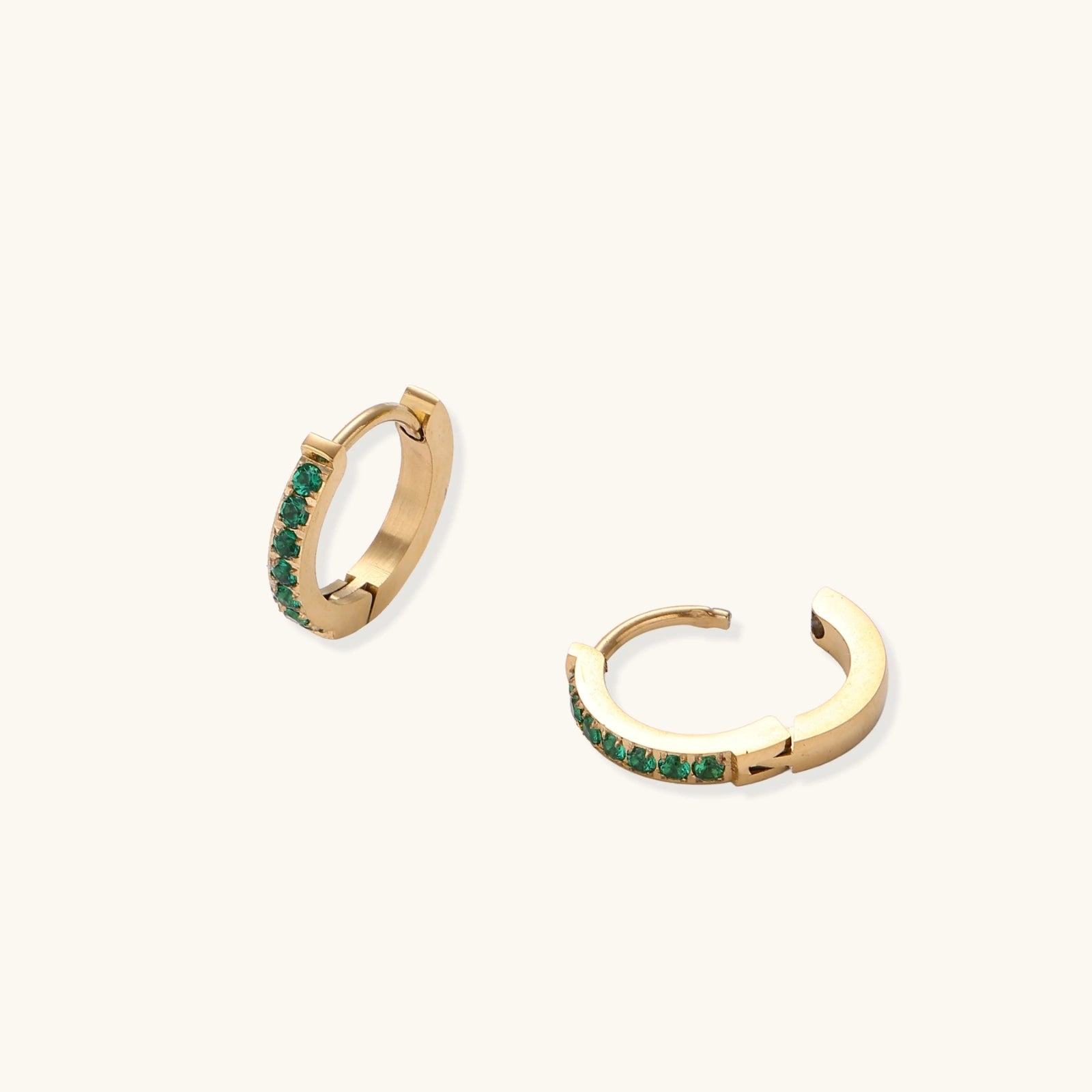 Emerald huggie hoops detail