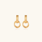 Triple ring gold-tone drop earrings close-up