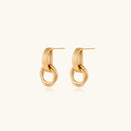 Architectural gold-tone drop earrings detail