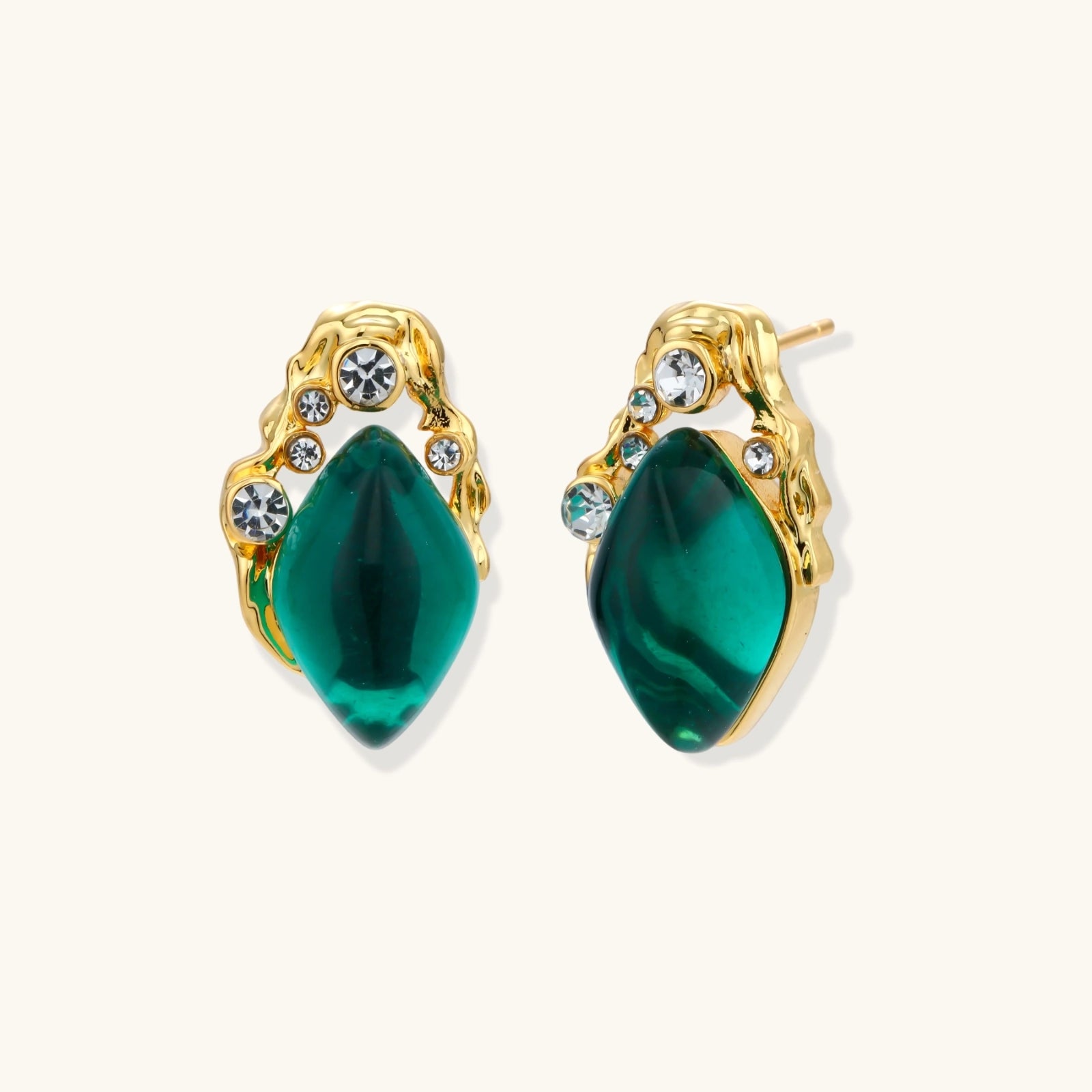Emerald green teardrop gold-tone stud earrings on white background