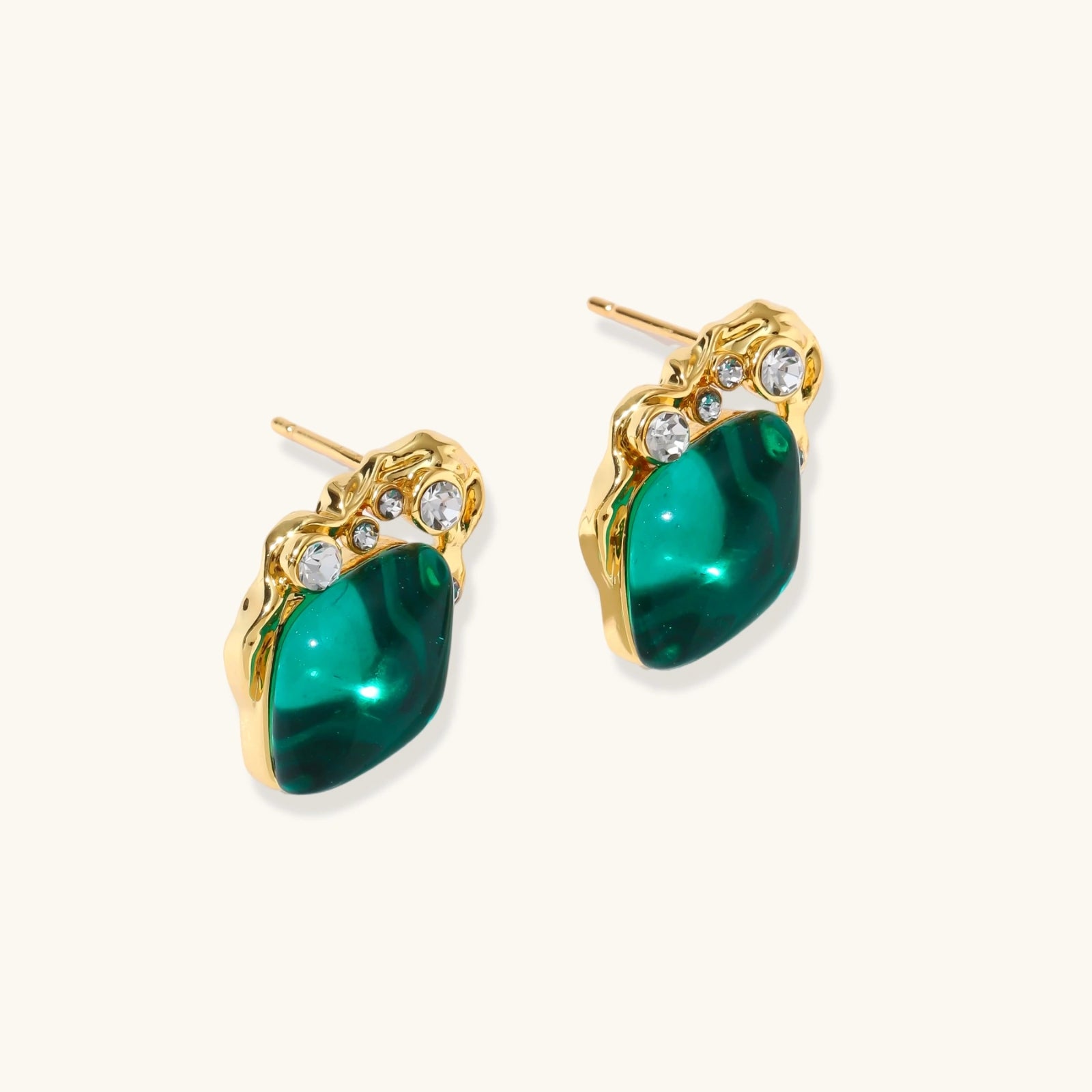 Gold-tone emerald studs shown as a pair