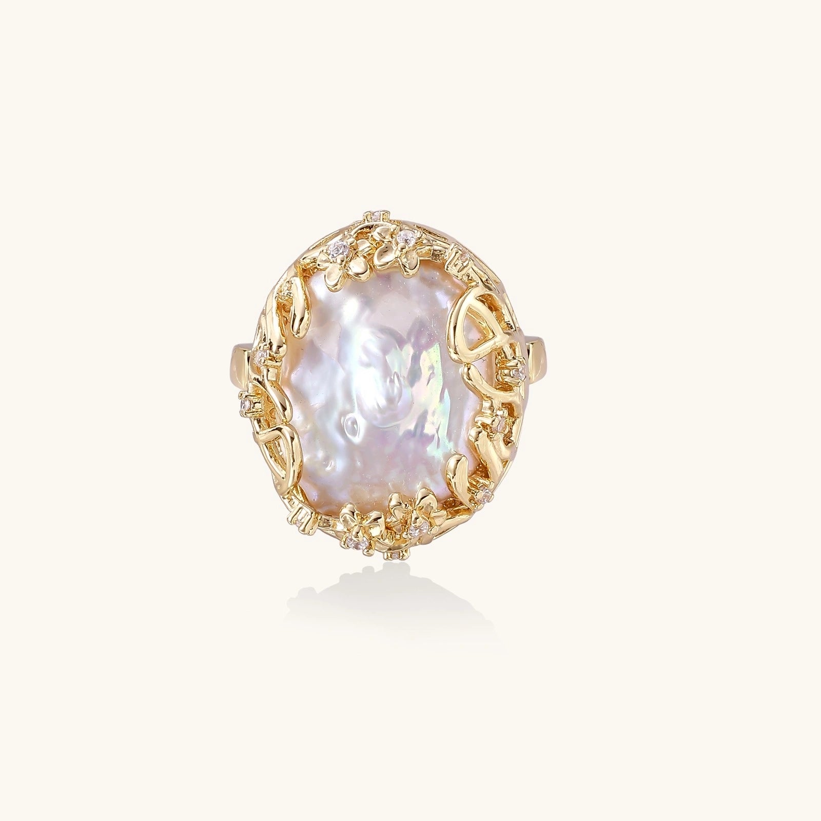 Gold-tone filigree pearl ring close-up