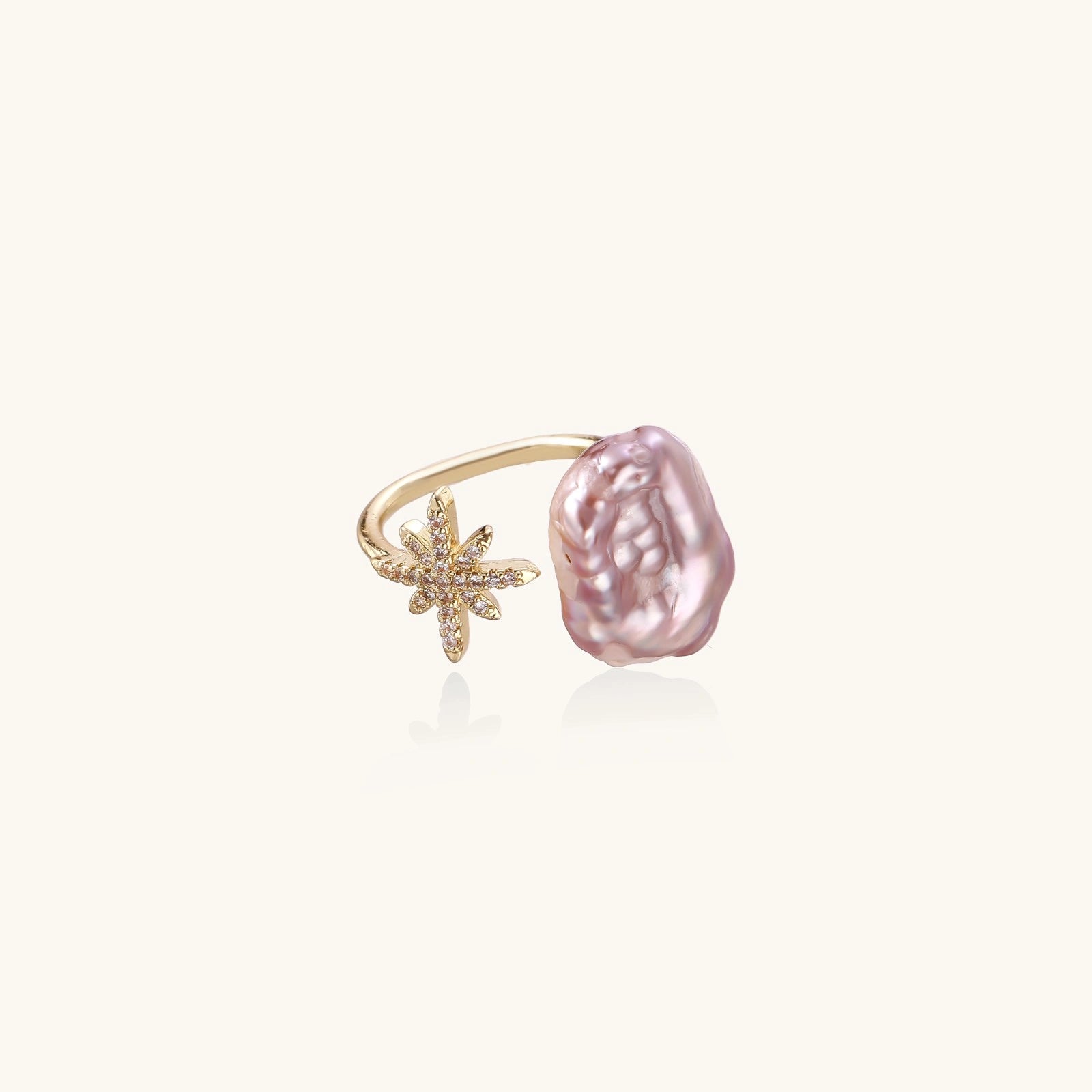 Adjustable gold-tone pearl star ring close-up