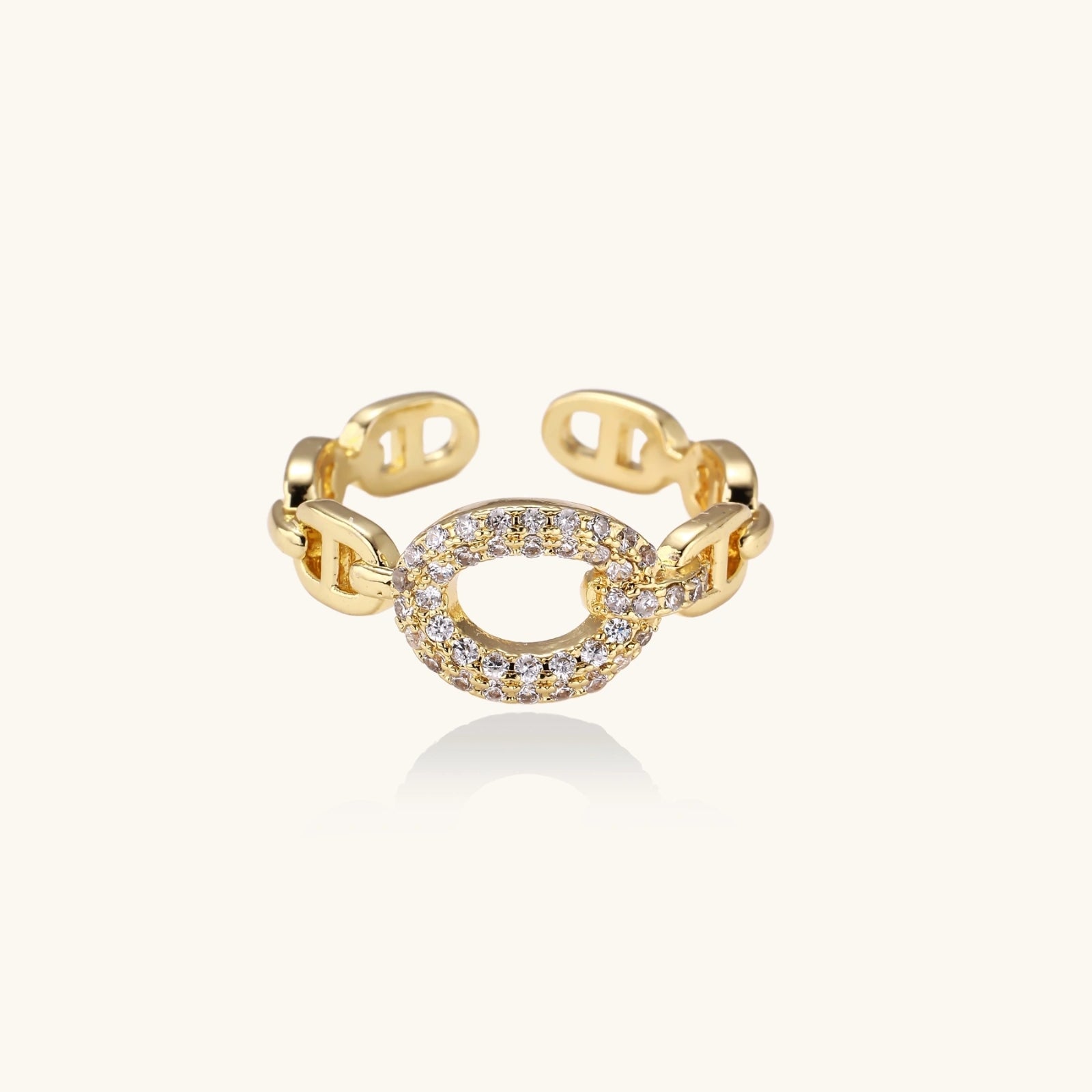 Gold-tone adjustable chain ring on cream background