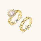 Gold-tone chain and crystal halo ring set on cream background