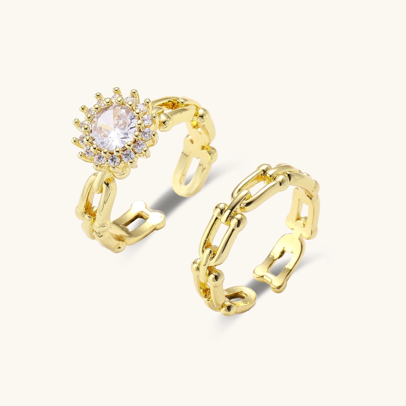 Gold-tone chain and crystal halo ring set on cream background