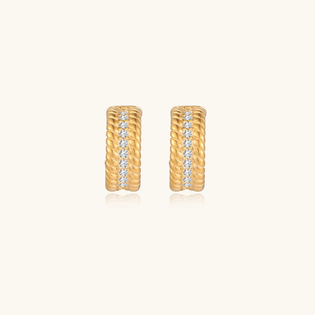 Textured gold-tone hoop earrings close-up