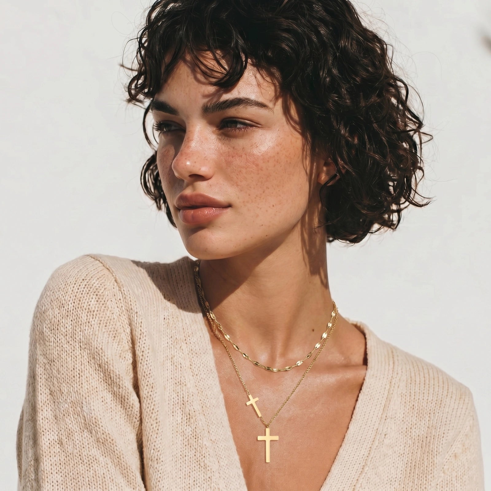Layered cross pendant necklace set close-up detail