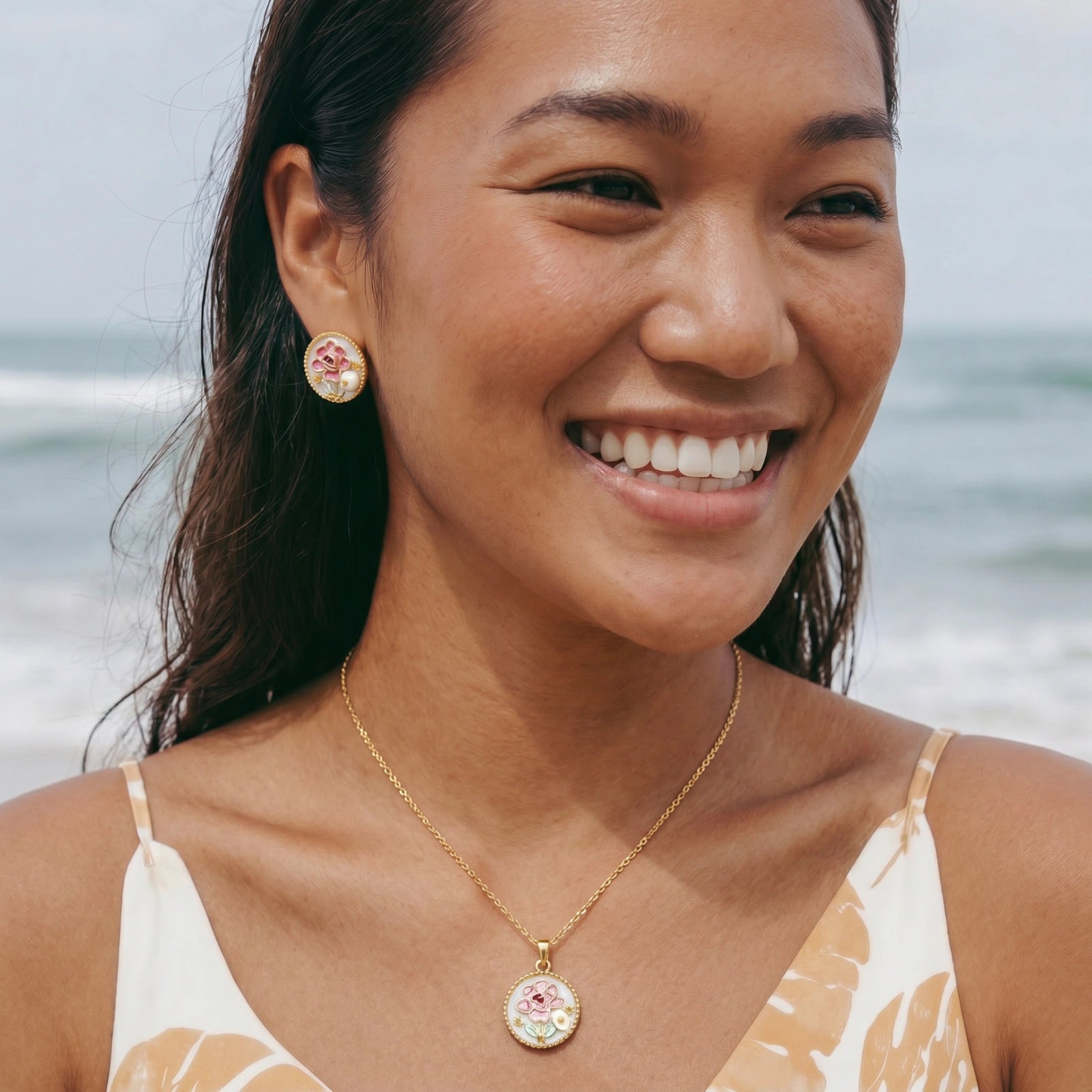 Enamel peony studs on white background